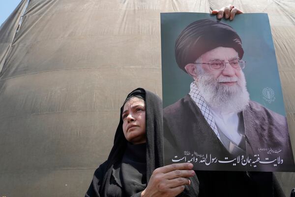 An Iranian protester holds up a poster of the Supreme Leader Ayatollah Ali Khamenei in an anti-Israeli gathering in Tehran, Iran, Friday, June 13, 2025. (AP Photo/Vahid Salemi)