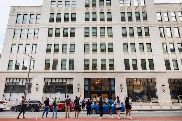 Philadelphia municipal workers, AFSCME District Council 33, labor union that represents 911 operators strike outside police headquarters on Tuesday, July 1, 2025 in Philadelphia, Pa. (Alejandro A Alvarez /The Philadelphia Inquirer via AP)