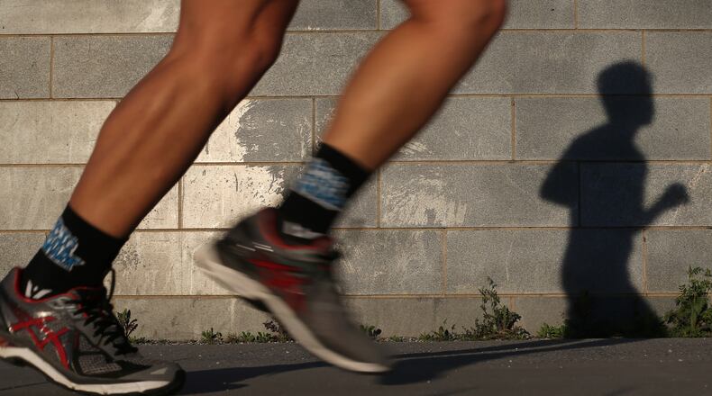 EVENING RUN--March 28, 2016 Atlanta: A runner takes advantage of the beautiful weather Monday evening March 28, 2016 to clock some miles on the Beltline Eastside Trail. Ben Gray / bgray@ajc.com