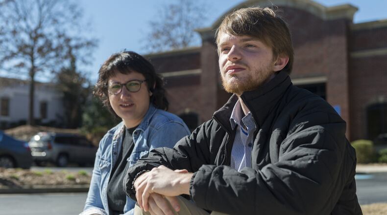 Emma Chancey (left) and Zach Hansen are both alumni of The Insight Program, a 12-step program for young adults and their families to help combat drug and alcohol abuse. Hansen is now five years sober after years of substance abuse. An important part of the program is communication between the individuals that are overcoming addiction, which is often done outside on a curb. CONTRIBUTED BY DAVID BARNES / SPECIAL