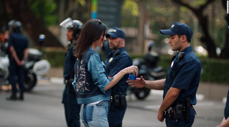 Portland anarchists used full Pepsi cans as weapons instead of peace offerings like Kendall Jenner. (Image from Pepsi's much derided ad.)