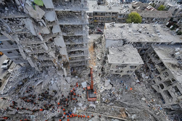Israeli soldiers search through the rubble of residential buildings destroyed by an Iranian missile strike in Bat Yam, central Israel, on Sunday, June 15, 2025. (AP Photo/Baz Ratner)