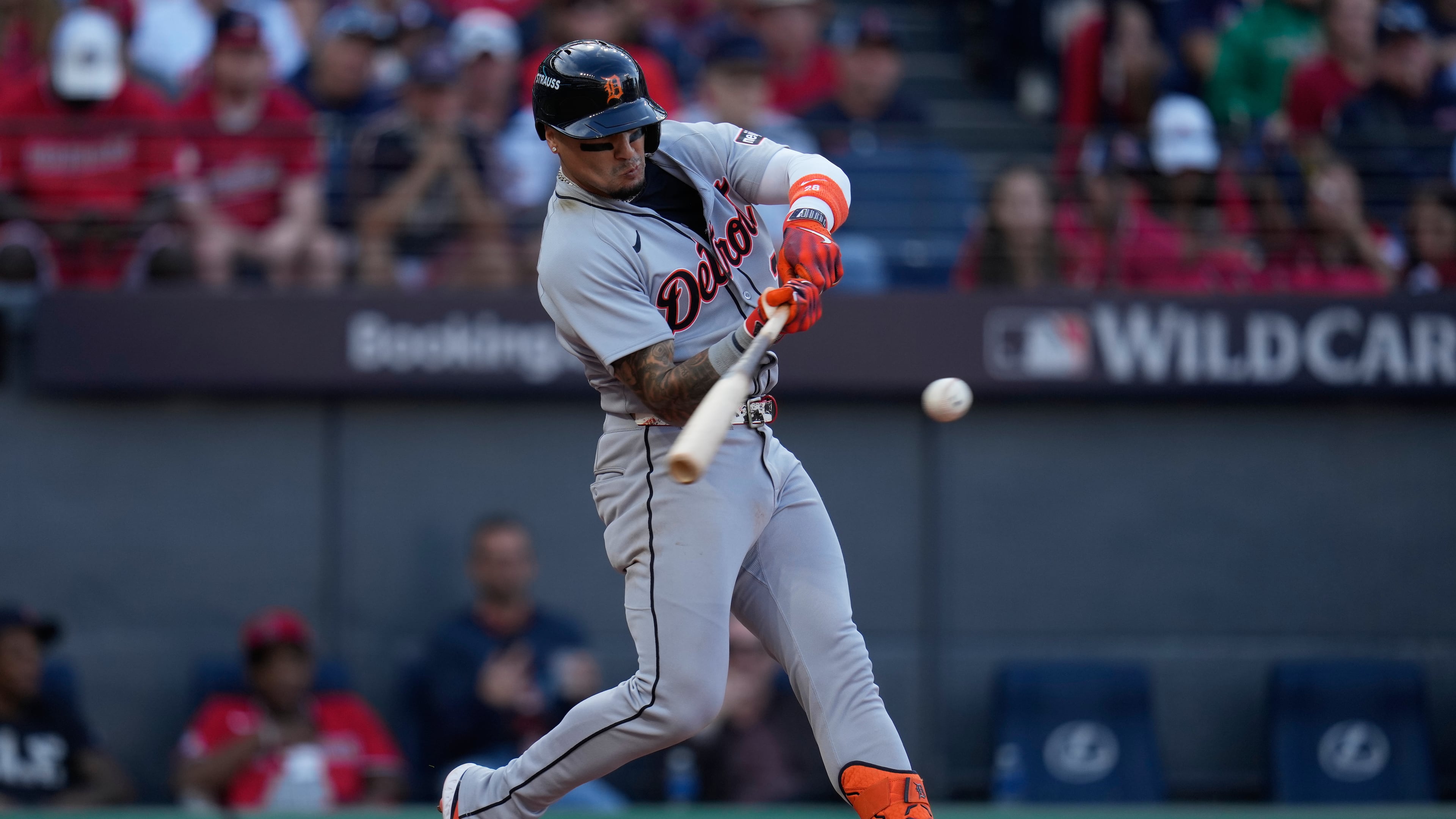 Detroit Tigers' Javier Báez (28) hits a double during the seventh inning of Game 3 of the American League Wild Card baseball playoff series against the Cleveland Guardians in Cleveland, Thursday, Oct. 2, 2025. (AP Photo/Sue Ogrocki)