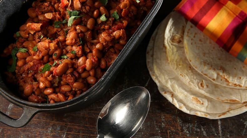 Charro beans get their flavor from bacon, Mexican chorizo and jalapeno. (Abel Uribe/Chicago Tribune/TNS)