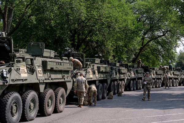 U.S. Army soldiers work on Stryker combat vehicles staged in West Potomac Park ahead of an upcoming military parade commemorating the Army's 250th anniversary and coinciding with Donald Trump's 79th birthday, Wednesday, June 11, 2025, in Washington (AP Photo/Julia Demaree Nikhinson)