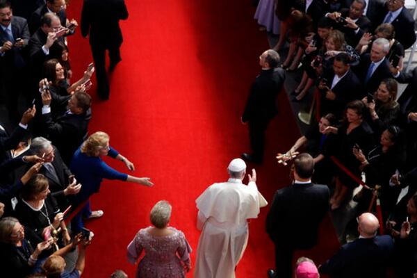 FILE - Flanked by Panama's President Juan Carlos Varela, right, and first lady Lorena Castillo, Pope Francis arrives at the foreign ministry headquarters Palacio Bolivar, in Panama City, Thursday, Jan. 24, 2019. (AP Photo/Alessandra Tarantino, file)
