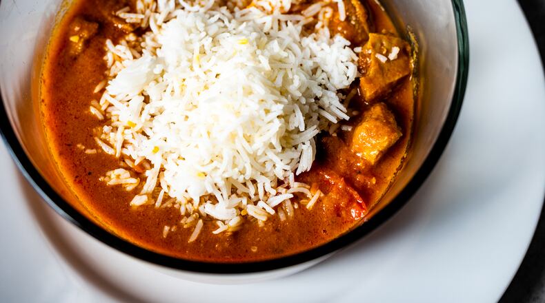Lamb madras curry from Touch Indian in Midtown is the perfect dish for that transitional time between summer and fall. Henri Hollis for The Atlanta Journal-Constitution.