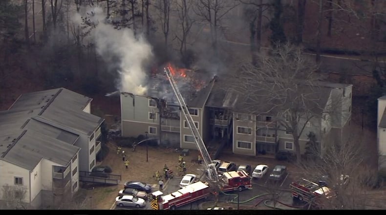 The fire started shortly after 11 a.m. in two upstairs units of the three-story building, fire officials said.