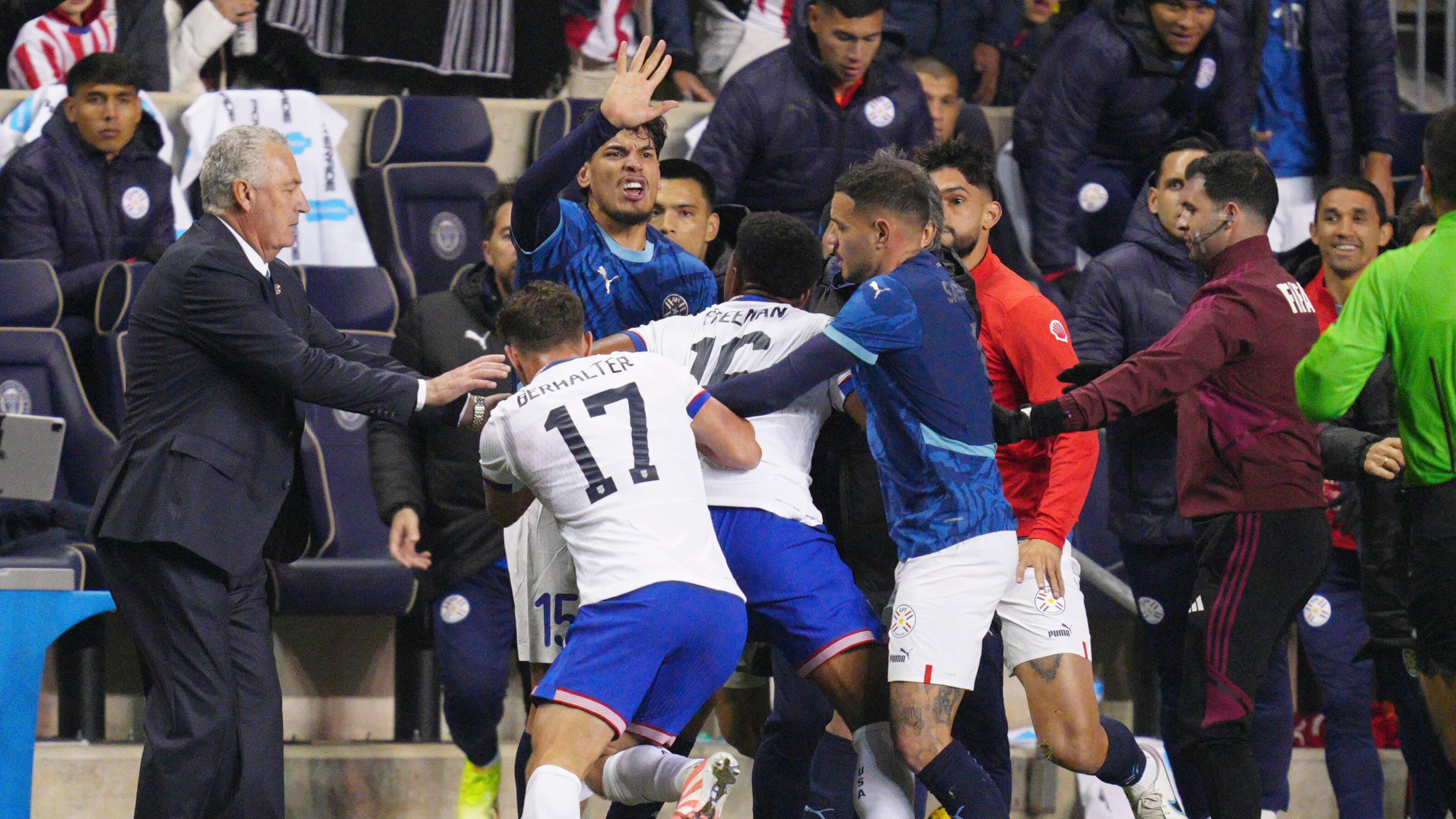 Paraguay's Gustavo Gomez (15), United States' Sebastian Berhalter (17) and Alex Freeman (16) and Paraguay's Antonio Sanabria scuffle on the sidelines during the second half of an international friendly soccer match, Saturday, Nov. 15, 2025, in Chester, Pa. (AP Photo/Derik Hamilton)