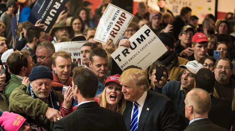 Donald Trump, a Republican presidential hopeful, meets with attendees during a campaign event in New Hampshire. Ian Thomas Jansen-Lonnquist/The New York Times