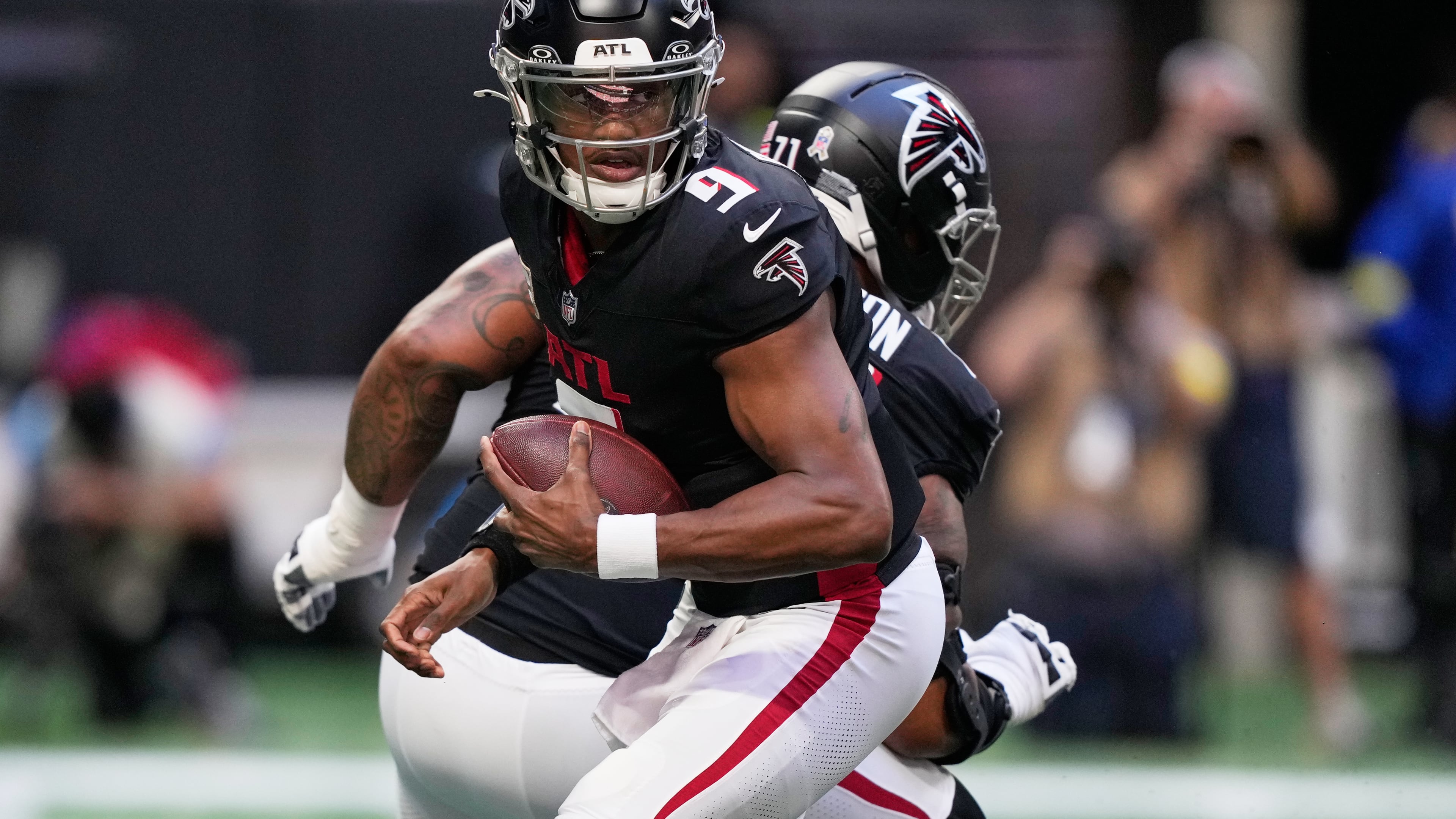 Atlanta Falcons quarterback Michael Penix Jr. (9) drops back against the Carolina Panthers in the first half of an NFL football game, Sunday, Nov. 16, 2025, in Atlanta. (AP Photo/Brynn Anderson)