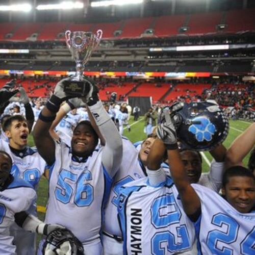 Camden County lineman Jeremiah Booth holds the Class 5A trophy after the Wildcats defeated Northside Warner Robins. Camden announced Jon Lindsey, whose first stint at Camden was from 2005 to 2010, as its new head football coach on Friday. (AJC 2009)