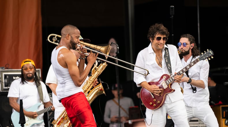 Trombone Shorty, left, and Pete Murano of Trombone Shorty & Orleans Avenue perform at the 2023 New Orleans Jazz & Heritage Festival on Sunday, May 7, 2023, at the Fair Grounds Race Course in New Orleans. (Photo by Amy Harris/Invision/AP)