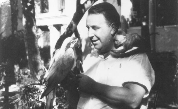 Addison Mizner with a macaw and his pet monkey Johnnie Brown. (Courtesy of the Historical Society of Palm Beach County)