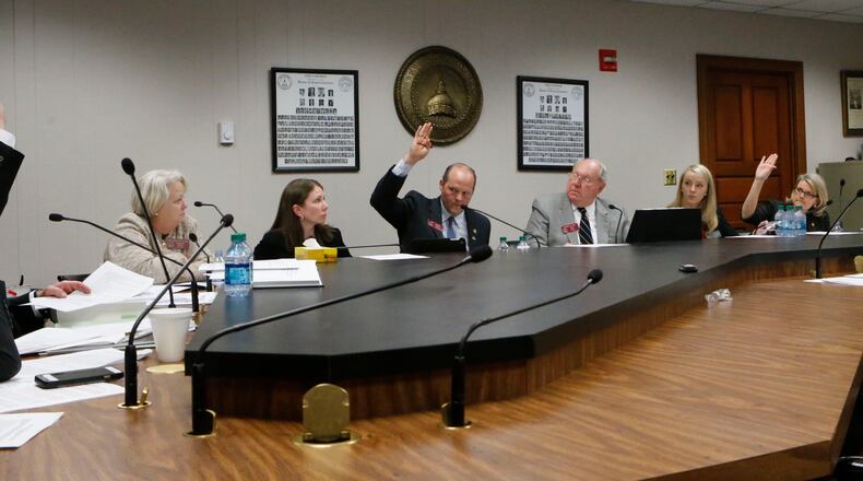 March 25, 2015 - Atlanta - The committee votes on one of the amendments to the bill by Senator Joshua McKoon (right) A special House subcommittee studying the 'religious liberty' bill met to make changes designed to add protections from unintended consequences. Supporters of SB 129 believe any amendment will kill the bill. One major convention has said it will not come to Georgia should the bill pass. The American Studies Association said it will not bring its 5,000 members and $1.4 million to Atlanta in 2018 should the bill pass. BOB ANDRES / BANDRES@AJC.COM A House Judiciary subcommittee votes on one of the amendments to S.B. 129, the religious liberty bill, last spring. Bob Andres, bandres@ajc.com