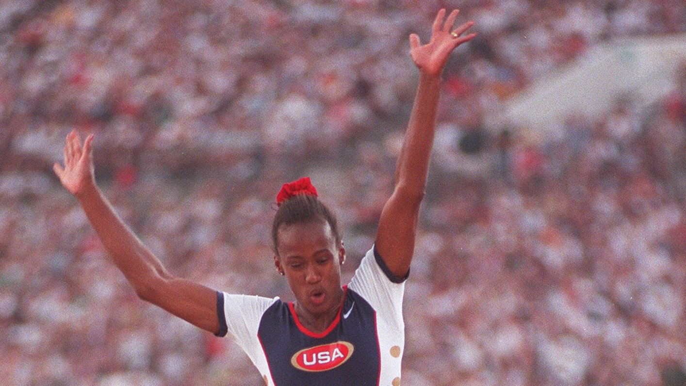 Jackie Joyner-Kersee of the U.S. women's track and field team is airborne for jump #2 in Long jump competition at the Olympic stadium Friday, Aug. 2, 1996, during the 1996 Summer Olympic Games in Atlanta, Georgia. (Karen Waren/AJC)
