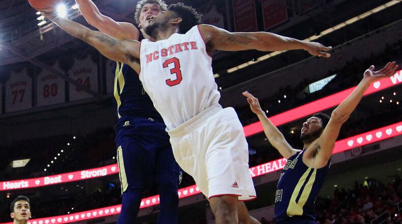 Georgia Tech's Ben Lammers (44) blocks the shot by North Carolina State's Terry Henderson (3) during the second half of an NCAA college basketball game in Raleigh, N.C., Sunday, Jan. 15, 2017. Georgia Tech won, 86-76. (Ethan Hyman/The News & Observer via AP)