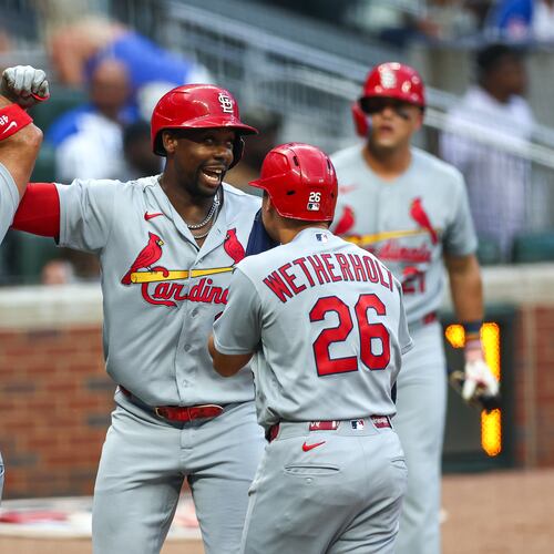 St. Louis Cardinals' Jordan Walker, center, reacts with Iván Herrera (48) and JJ Wetherholt (26) after hitting a three-run home run in the first inning of a baseball game against the Atlanta Braves, Thursday, July 2, 2026, in Atlanta. (AP Photo/Colin Hubbard)
