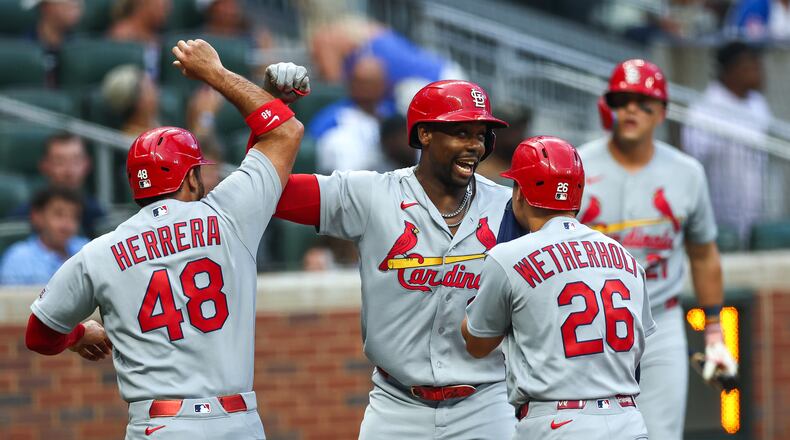 St. Louis Cardinals' Jordan Walker, center, reacts with Iván Herrera (48) and JJ Wetherholt (26) after hitting a three-run home run in the first inning of a baseball game against the Atlanta Braves, Thursday, July 2, 2026, in Atlanta. (AP Photo/Colin Hubbard)