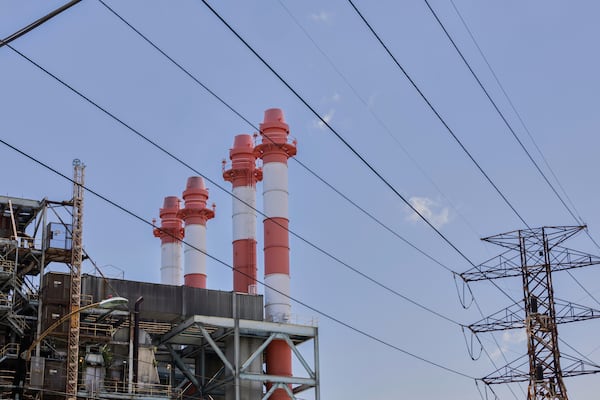 Power lines rise in front of electric towers and smokestacks at the Palo Seco power plant in Toa Baja, Puerto Rico, Thursday, May 8, 2025. (AP Photo/Alejandro Granadillo)