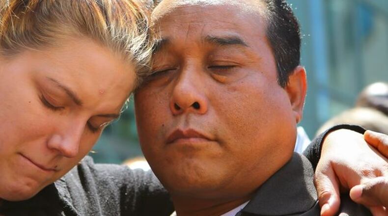 The parents of a toddler disfigured in a botched Georgia drug raid attend a prayer vigil.