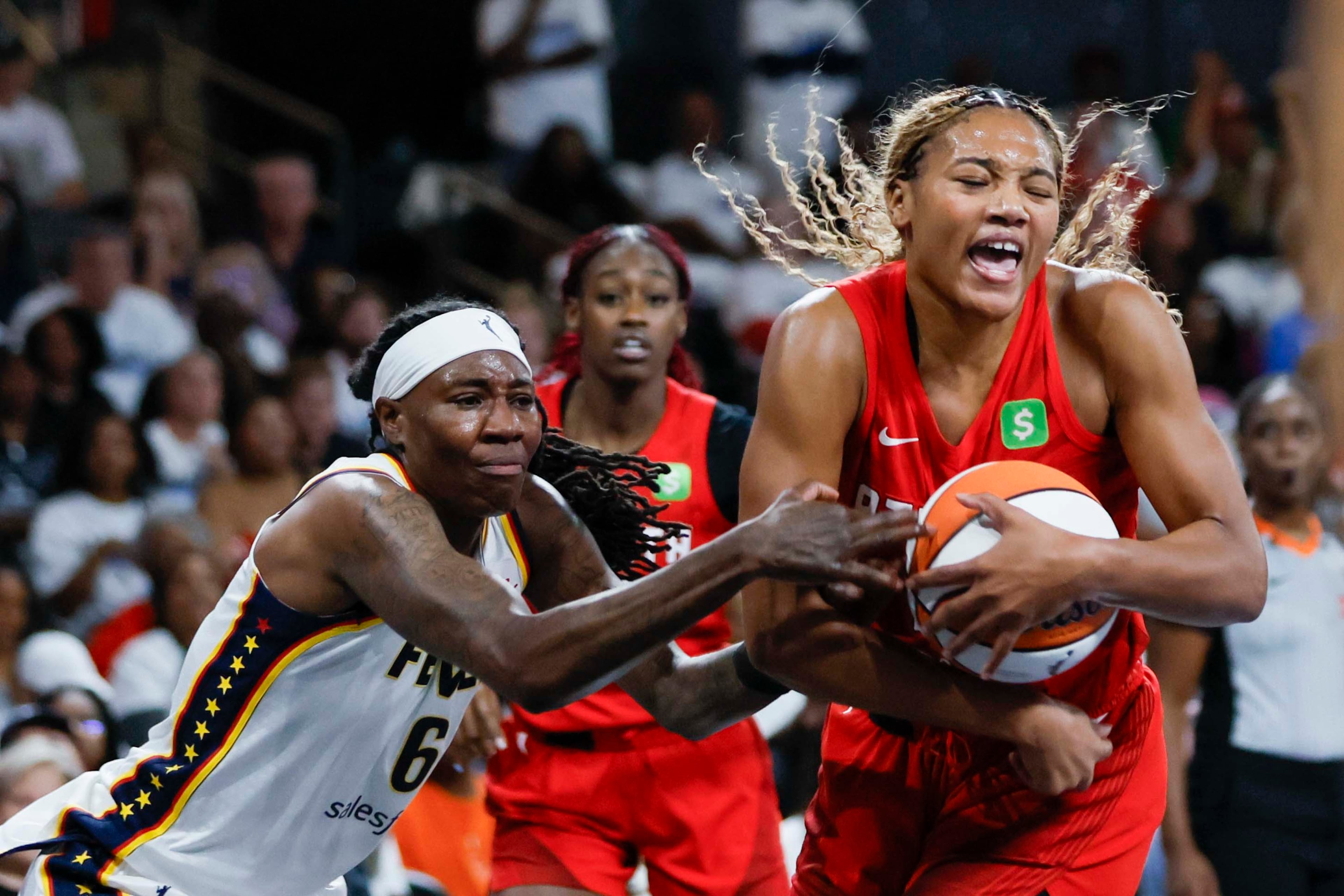 Atlanta Dream forward Naz Hillmon (00) reacts as she steals the ball from Indiana Fever forward Natasha Howard (6) during the second half of a WNBA playoff first-round game at Gateway Center Arena on Sunday, Sept. 14, 2024, in Atlanta.
(Miguel Martinez/ AJC)