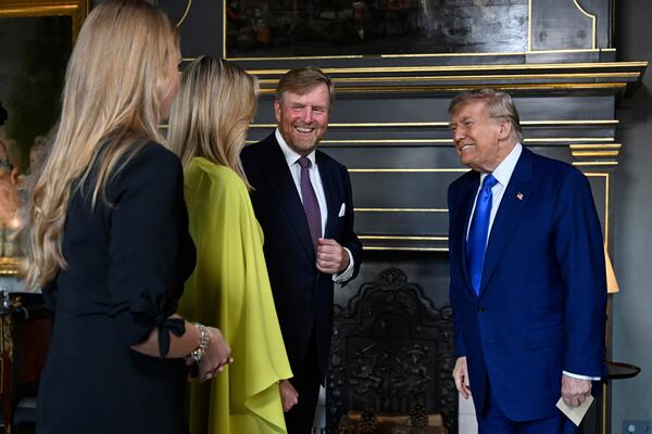 President Donald Trump, right, is welcomed by Netherland's King Willem Alexander, Netherland's Queen Maxima and Netherland's Crown Princess Amalia as he arrives for a formal dinner at the Paleis Huis ten Bosch ahead of the NATO summit in The Hague, Netherlands, Tuesday, June 24, 2025. (Misha Schoemakers, Pool Photo via AP)