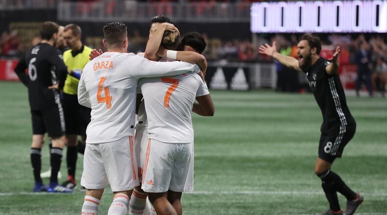 Atlanta United midfielder Josef Martinez celebrates scoring a goal with this teammates against Sporting Kansas City that was wiped away by video review during the first half in a MLS soccer match on Wednesday, May 9, 2018, in Atlanta.  Curtis Compton/ccompton@ajc.com