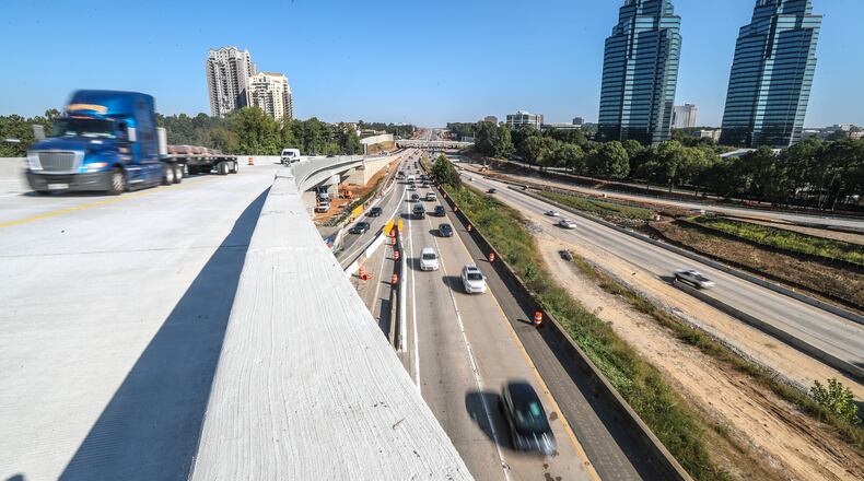 October 5, 2020 Atlanta: Traffic traveled across the new flyover ramp on Ga. 400 South at I-285 East for the first time on Monday Oct. 5, 2020. First time motorists complained Monday about poor signage and expressed confusion to the WSB 24-hour Traffic Center. Drivers on Ga. 400 southbound to I-285 eastbound will need to merge to the farthest right lane on Ga. 400 southbound and merge onto the ramp just before the Hammond Drive overpass. Drivers will travel on the over 80-foot tall ramp until it merges with I-285 eastbound just before the Perimeter Center Parkway overpass. GDOT officials say there are signs warning drivers of the changes before the new configuration. The new I-285 interchange at Ga. 400 north of Atlanta was supposed to be finished by the end of this year. Thanks to the discovery of unmarked utilities and the addition of work to the project, the new target date is late 2021, according to the Georgia Department of Transportation. It's the second delay for the $800 million project. (John Spink / John.Spink@ajc.com)