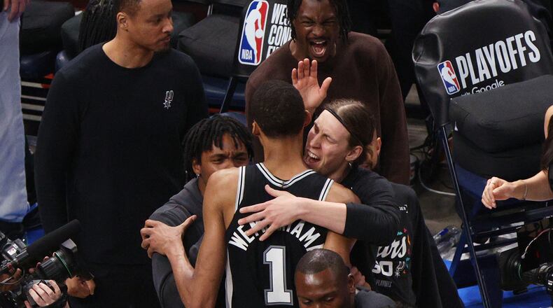 San Antonio Spurs forward Victor Wembanyama (1) celebrates with teammates after winning Game 1 in a third-round NBA basketball playoffs series against the Oklahoma City Thunder Monday, May 18, 2026, in Oklahoma City. (AP Photo/Nate Billings)