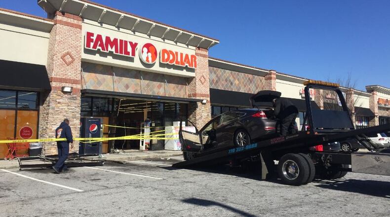 A Hyundai Sonata crashed into the Family Dollar store on Rockbridge Road on Saturday afternoon. (Credit: Channel 2 Action News)