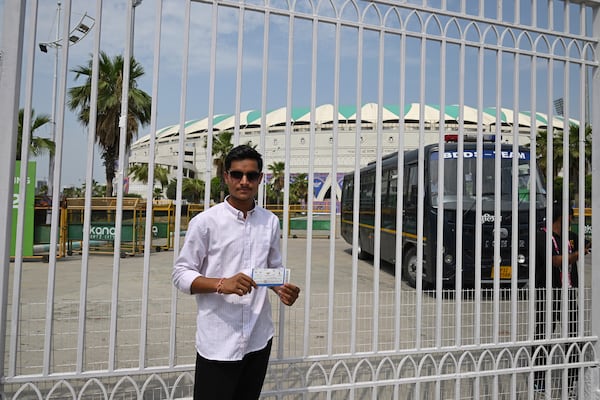 A fan displays his ticket outside a closed entrance of Atal Bihari Vajpayee Ekana Cricket Stadium after organizers suspended the Indian Premier League for one week following the escalating military tensions with Pakistan, in Lucknow, India, Friday, May 9, 2025. (AP Photo)