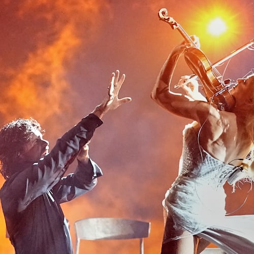 Linda Lampenius and Pete Parkkonen from Finland perform the song "Liekinheitin" during the Grand Final of the 70th Eurovision Song Contest in Vienna, Austria, Saturday, May 16, 2026. (AP Photo/Martin Meissner)