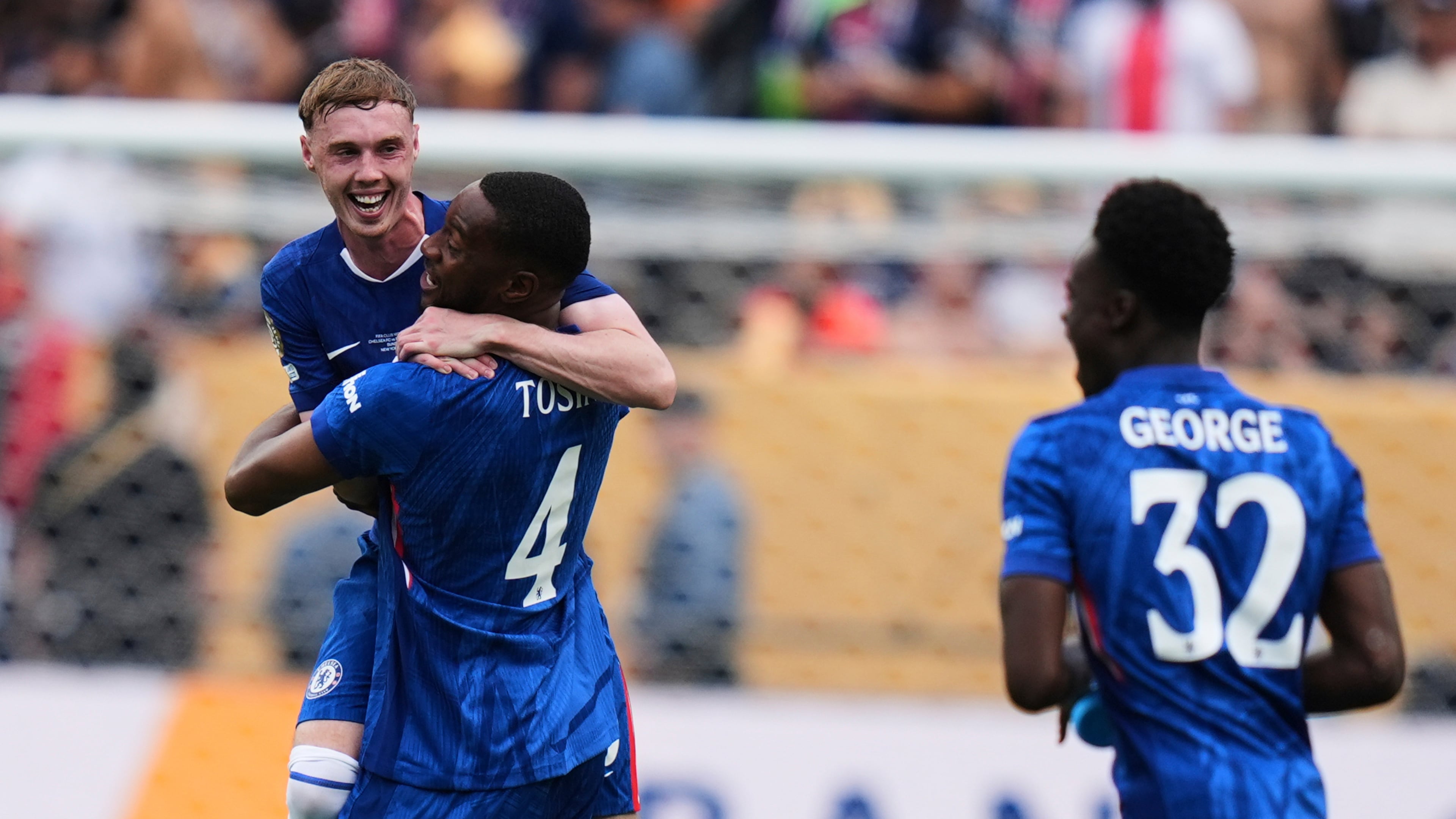 Chelsea's Cole Palmer (10), Tosin Adarabioyo (4) and Tyrique George (32) celebrate after winning the Club World Cup final soccer match between Chelsea and PSG in East Rutherford, N.J., Sunday, July 13, 2025. (AP Photo/Seth Wenig)