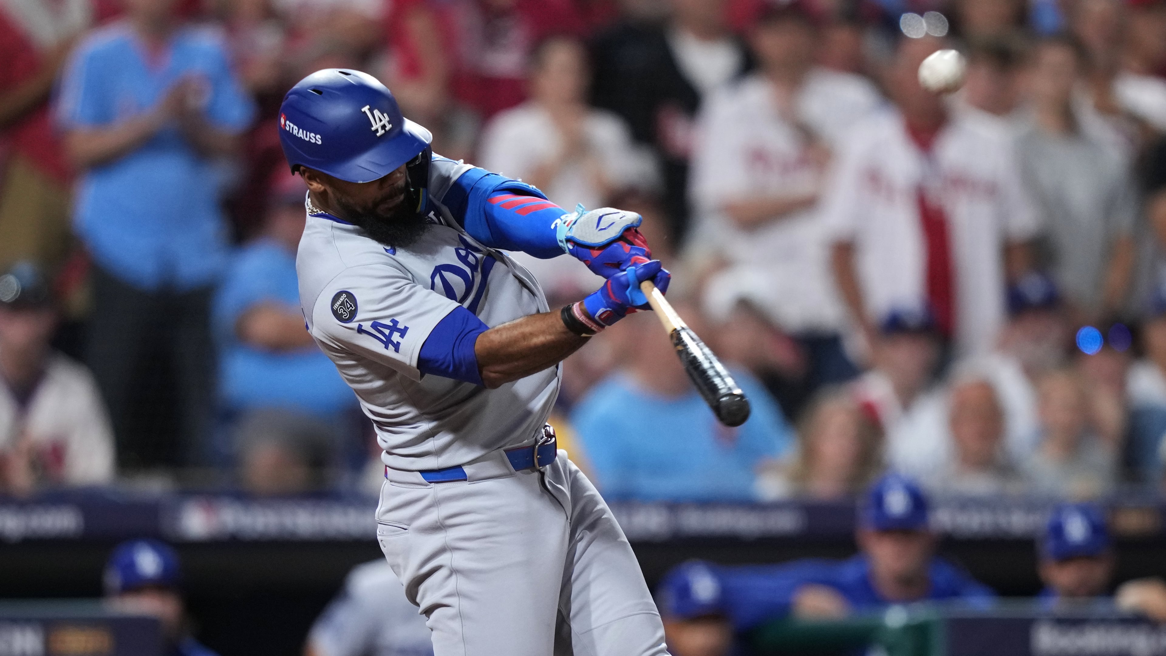 Los Angeles Dodgers' Teoscar Hernández hits a three-run home run against Philadelphia Phillies pitcher Matt Strahm during the seventh inning in Game 1 of baseball's National League Division Series, Saturday, Oct. 4, 2025, in Philadelphia. (AP Photo/Matt Slocum)