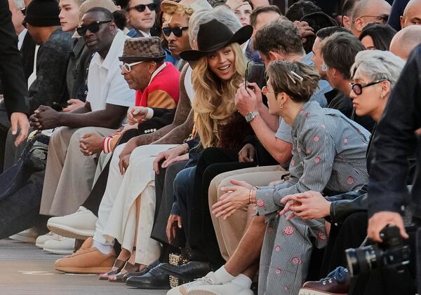 Beyonce, center, attends the men's Louis Vuitton Spring-Summer 2026 collection, that was presented in Paris, Tuesday, June 24, 2025. (AP Photo/Michel Euler)