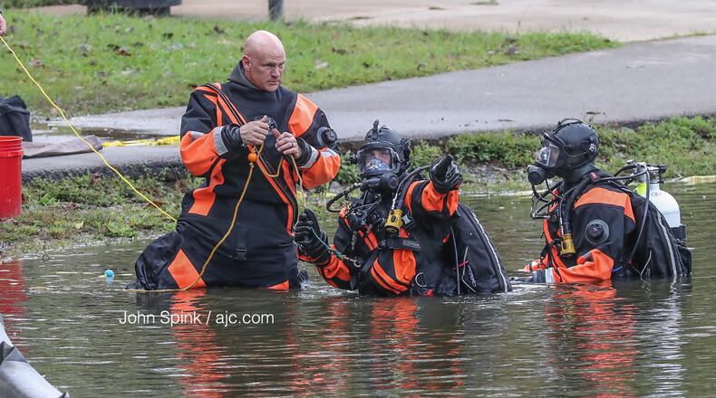 Dive crews investigate the car that had become submerged in Buena Vista Lake on Wednesday night.