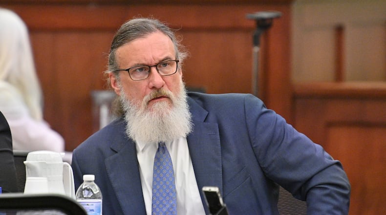 January 31, 2022 Americus - Attorney William McCall Calhoun sits next to his client Deontrey Parker (not pictured) during jury selection for alleged drug-related murder trial before Superior Court Judge Jimmie Brown (not pictured) at Sumter County Courthouse in Americus on Monday, January 31, 2022. Americus attorney William McCall Calhoun is out on bond and facing felony charges related to his activities at the U.S. Capitol on Jan. 6, 2021. While on bond, he is subject to home confinement and GPS monitoring (ankle monitor). (Hyosub Shin / Hyosub.Shin@ajc.com)