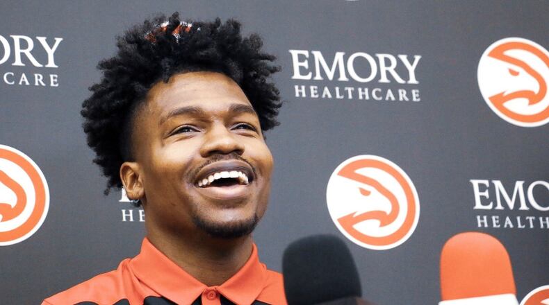 Brandon Goodwin talks with the hometown press after signing his two-way contract with the Hawks. (Andy Bowers/Hawks Digital