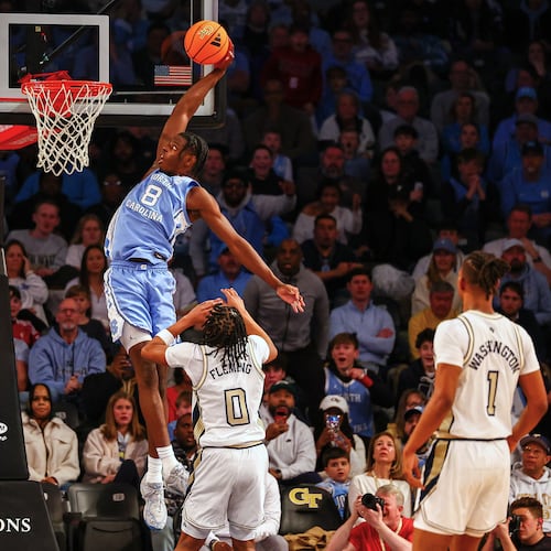 North Carolina forward Caleb Wilson (8) dunks over Georgia Tech guard Akai Fleming (0) during the first half of an NCAA college basketball game, Saturday, Jan. 31, 2026, in Atlanta. (AP Photo/Colin Hubbard)