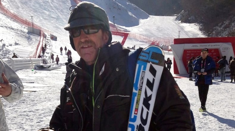 In this Sunday, Feb. 7, 2016 photo, Tom Johnston stands near the finish area following a men's World Cup super-G race, also a test event for the Pyeongchang 2018 Winter Olympics, at the Jeongseon Alpine Centre in Jeongseon, South Korea. From Colorado to South Korea with Russia in between, he's the master of the snow - a Wyoming cowboy gone global. Cattle rancher Johnston is the chief of race for the Alpine skiing events at the 2018 Pyeongchang Olympics, the man responsible for preparing the snow at the next Winter Games. (AP Photo/Andrew Dampf)