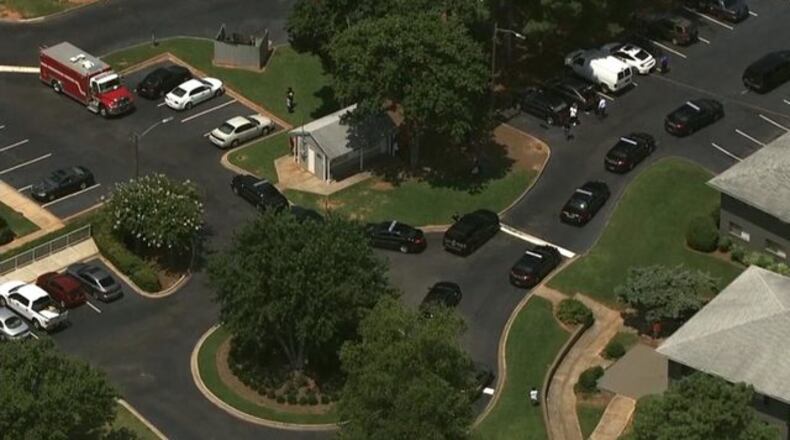 Police are investigating a deadly shooting outside an apartment in Cobb County. (Credit: Channel 2 Action News)