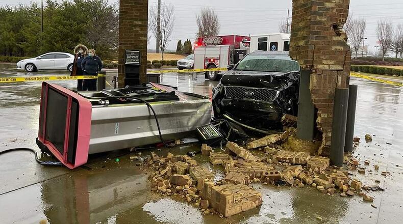 Investigators believe a distracted driver struck a Dawson County gas pump on New Year's Day.