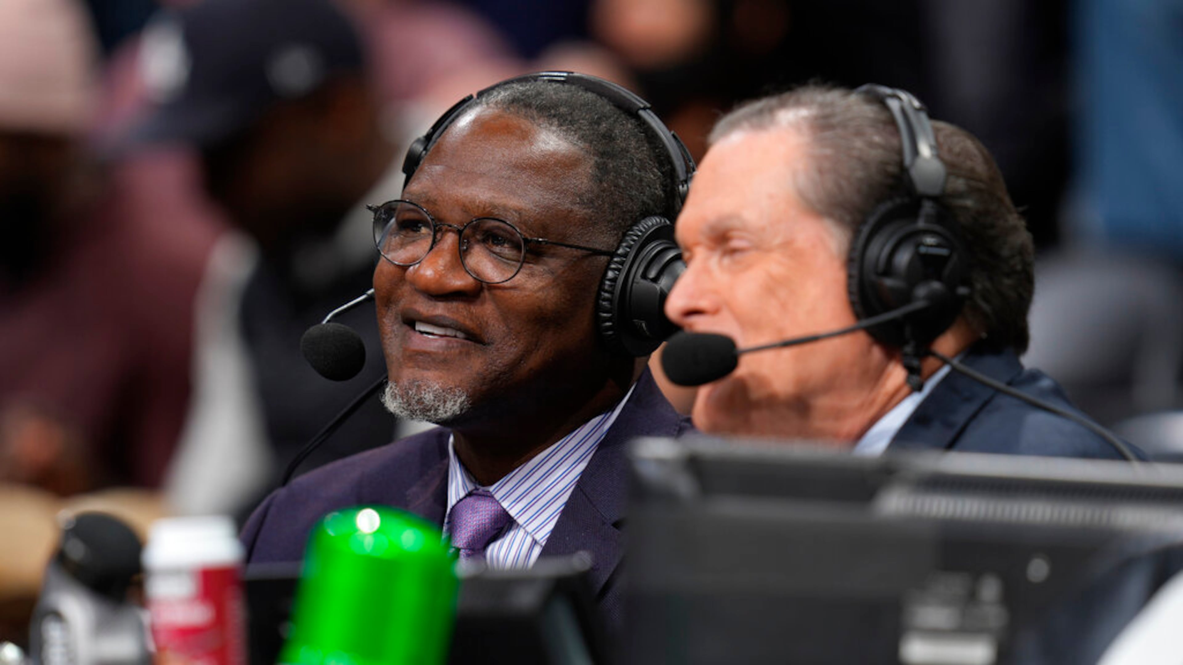 Hawks television analyst Dominique Wilkins (left), along with play-by-play announcer Bob Rathbun, will call all three exhibition games. (David Zalubowski/AP 2021)