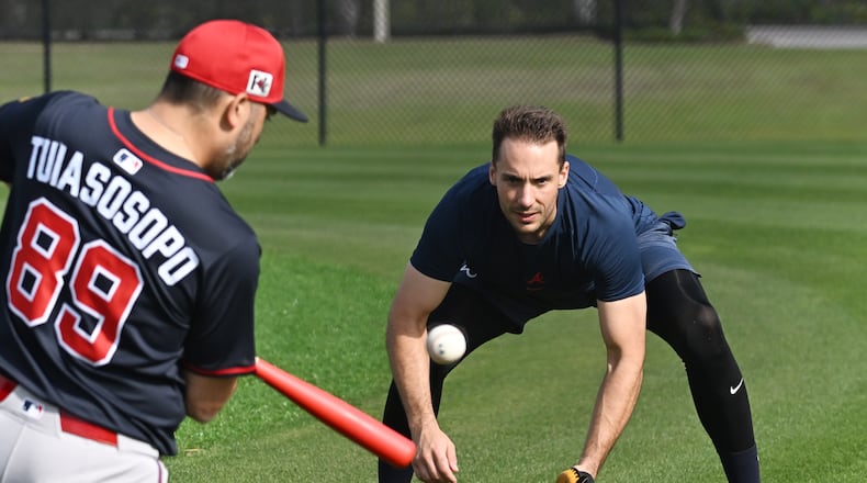 Atlanta Braves first base Matt Olson practices with third base coach Matt Tuiasosopo during spring training workouts at CoolToday Park, Thursday, February 13, 2025, North Port, Florida. (Hyosub Shin / AJC)
