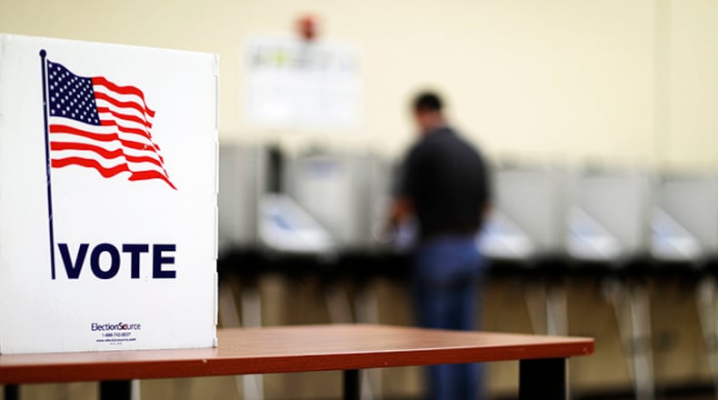A voter casts his ballot in Georgia's 6th Congressional District special election at a polling site in Sandy Springs, Ga., Tuesday, June 20, 2017.