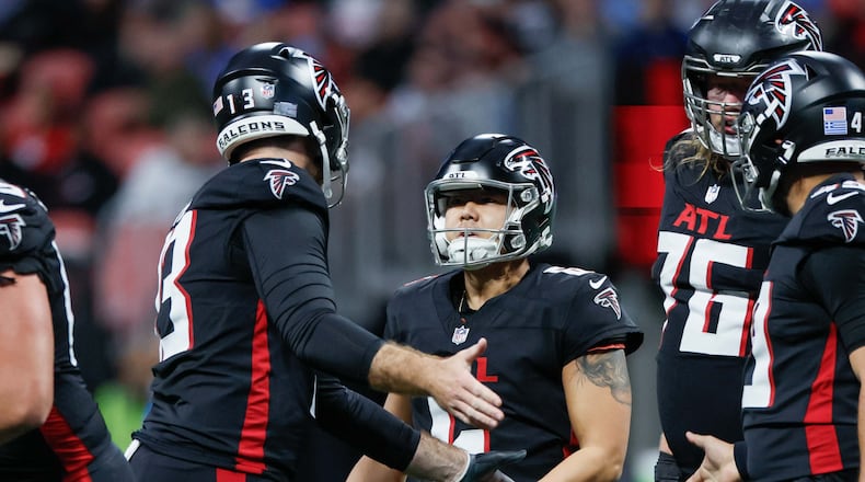 Atlanta Falcons punter Bradley Pinion (13) speaks with Atlanta Falcons place kicker Younghoe Koo (6) after missing a field goal during the first half of an NFL football game against the Los Angeles Chargers on Sunday, December 1, 2024, at Mercedes-Benz Stadium in Atlanta.
(Miguel Martinez/ AJC)