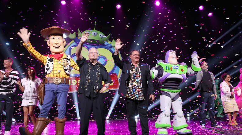 ANAHEIM, CA - AUGUST 14: Composer Randy Newman of TOY STORY 1, 2 and 3 and director John Lasseter of TOY STORY 4 (C) took part today in 'Pixar and Walt Disney Animation Studios: The Upcoming Films' presentation at Disney's D23 EXPO 2015 in Anaheim, Calif. (Photo by Jesse Grant/Getty Images for Disney)