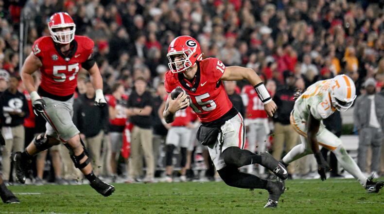 Georgia quarterback Carson Beck (15) runs for a touchdown during the second half in an NCAA football game at Sanford Stadium, Saturday, November 16, 2024, in Athens. Georgia won 31-17 over Tennessee. (Hyosub Shin / AJC)