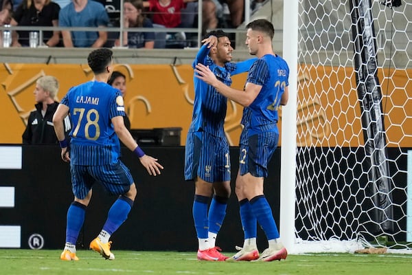 Al Hilal's Marcos Leonardo, centre, is congratulated by teammates after scoring his team's fourth goal during the Club World Cup round of 16 soccer match between Manchester City and Al Hilal in Orlando, Fla., Monday, June 30, 2025. (AP Photo/John Raoux)